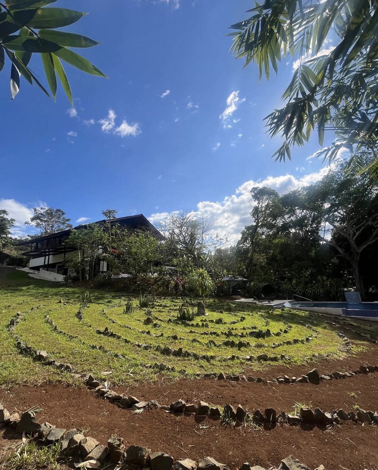 Stone labyrinth on the lawn beside the pool