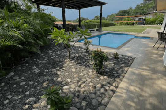 Pool and tropical garden at the Costa Rica retreat property